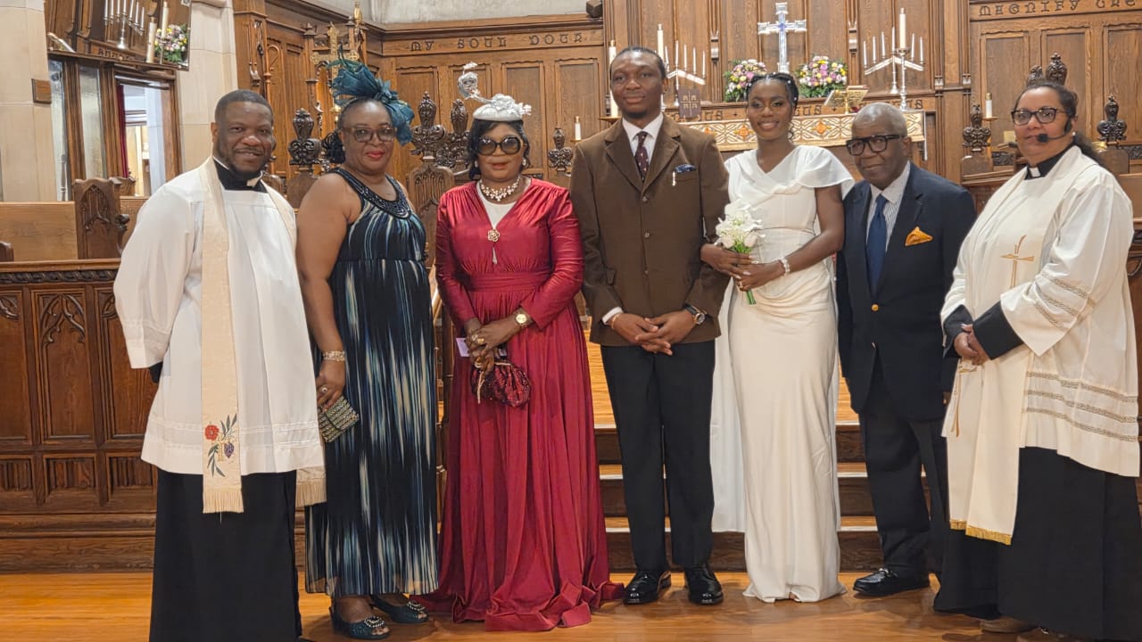 NUJ Deputy National  President, Dr. (Mrs.) Abimbola Oyetunde, flanked by clergymen and family members, at the wedding ceremony of her daughter, Oluwatomisin Oyetunde, held in Oshawa, Ontario, Canada.